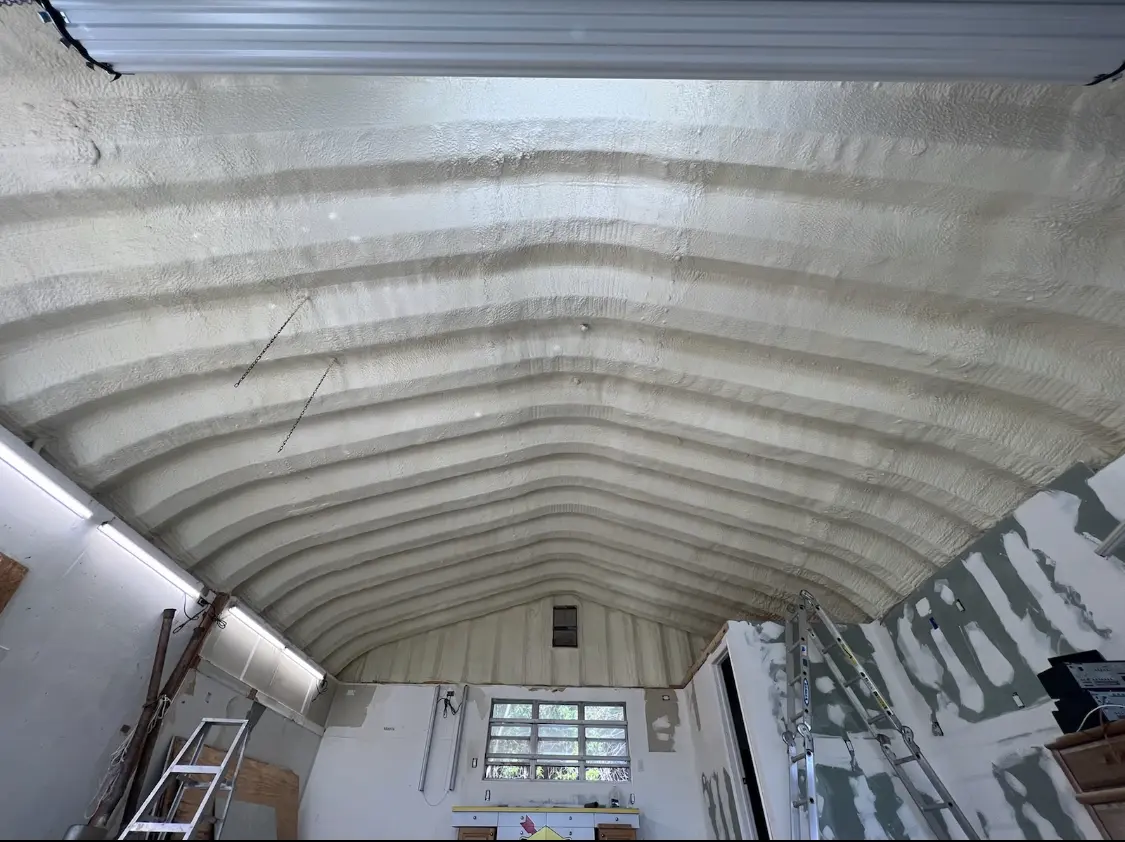 Spray polyurethane foam applied to the underside of a metal roof deck in Cramerton